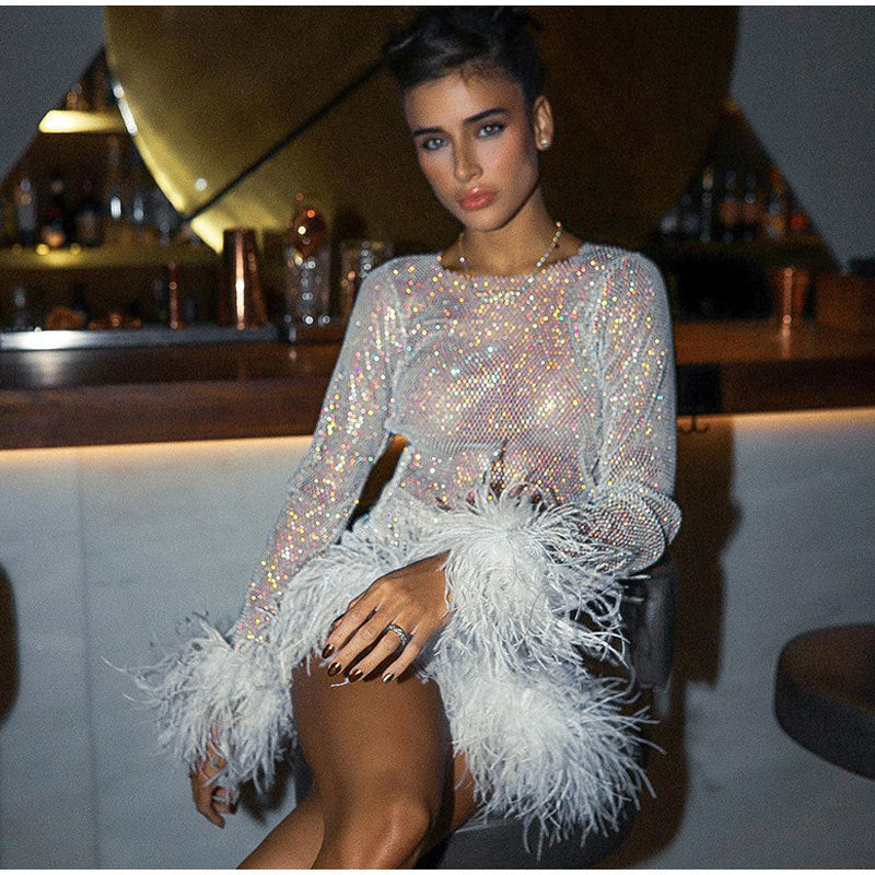 2023 fashion trends, glitter outfit, crop top skirt outfit with feather and rhinestone glitter , shimmery dress