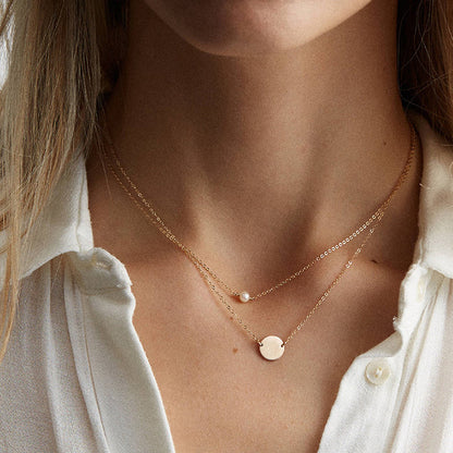 minimalist pearl necklace with pearl and and circle pendant 